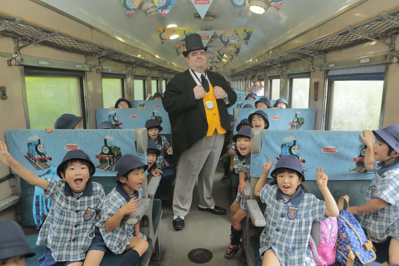 children are excited to meet the conductor aboard Thomas the train in Shizuoka Oigawa Railway in Japan