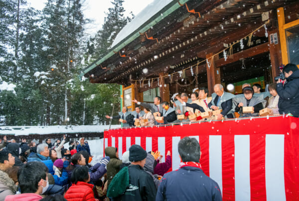 Japanese people celebrating Setsubun event in a temple