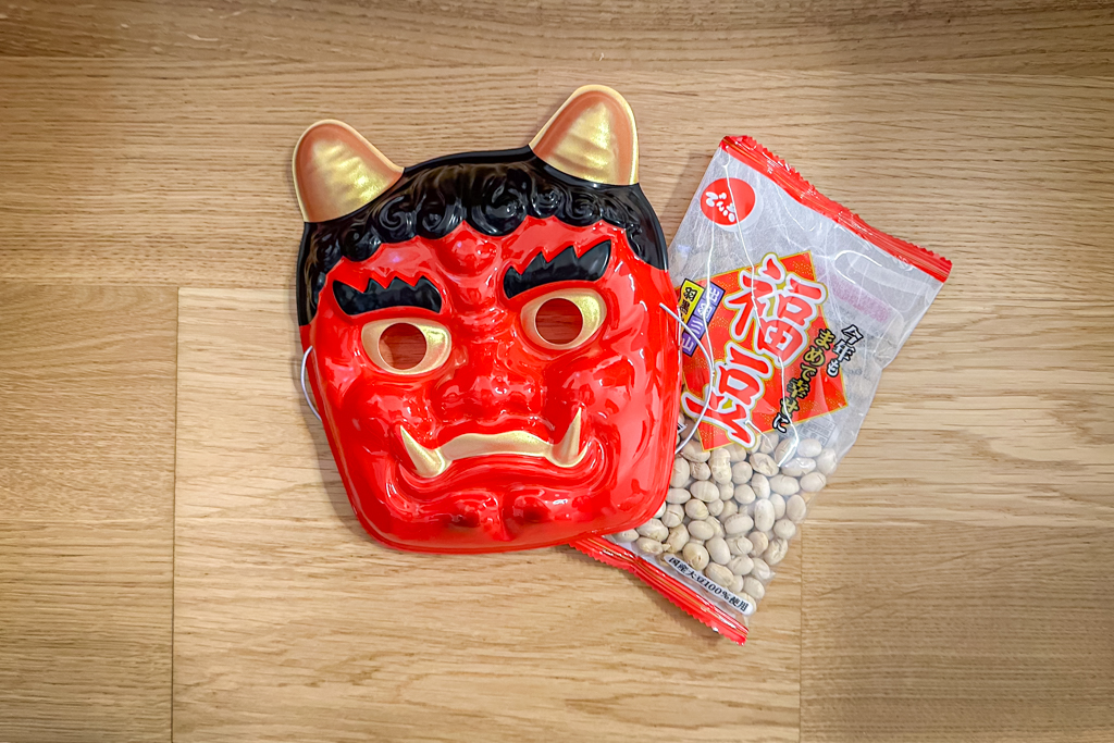 A demon mask and beans