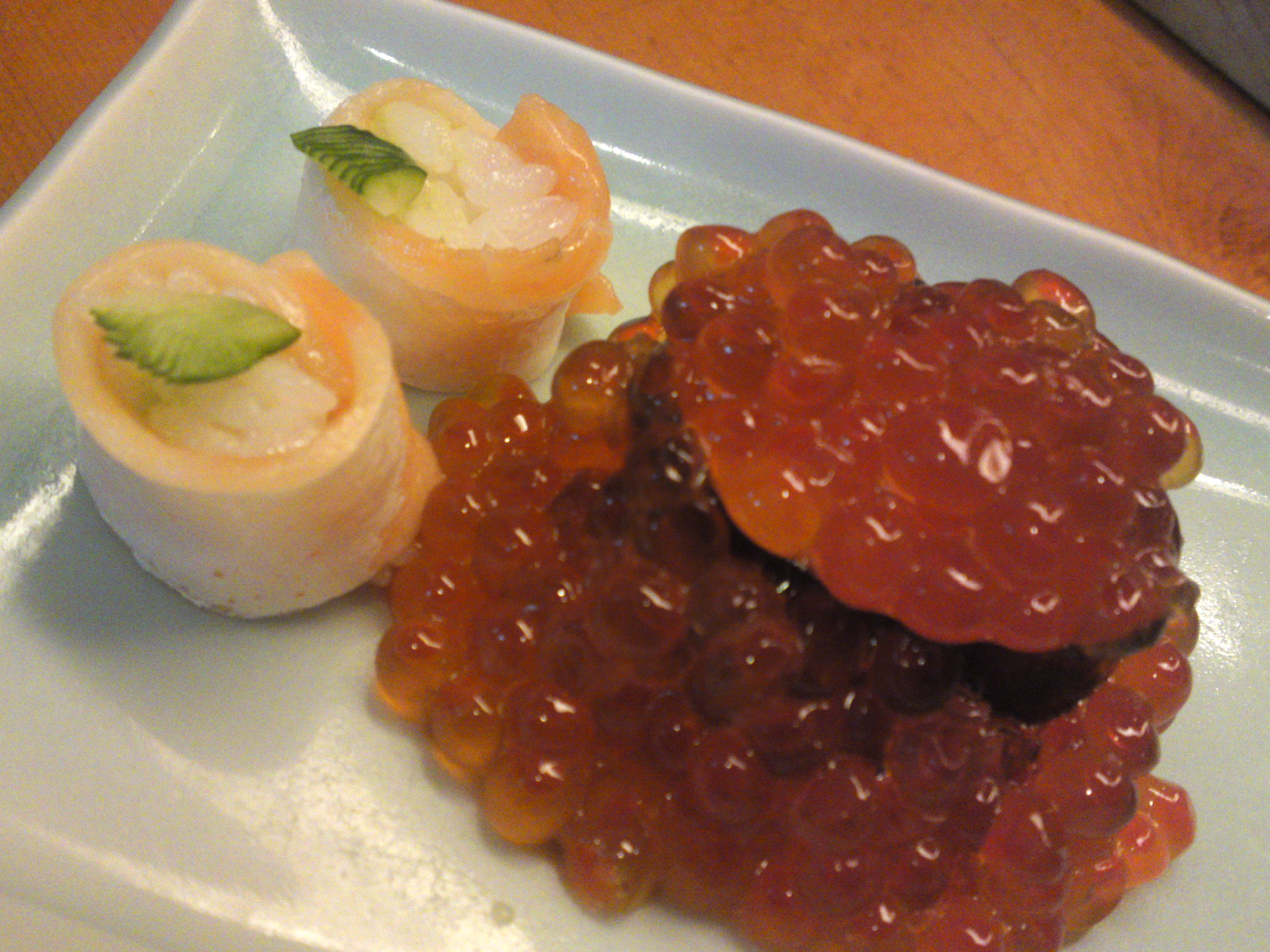 A rare “Oyako/Parent and Child” rendition of “Ikura/salmon Roe” gunkan with its two “kids in the form of small gunkan with raw salmon wrapped around minuscule rice balls