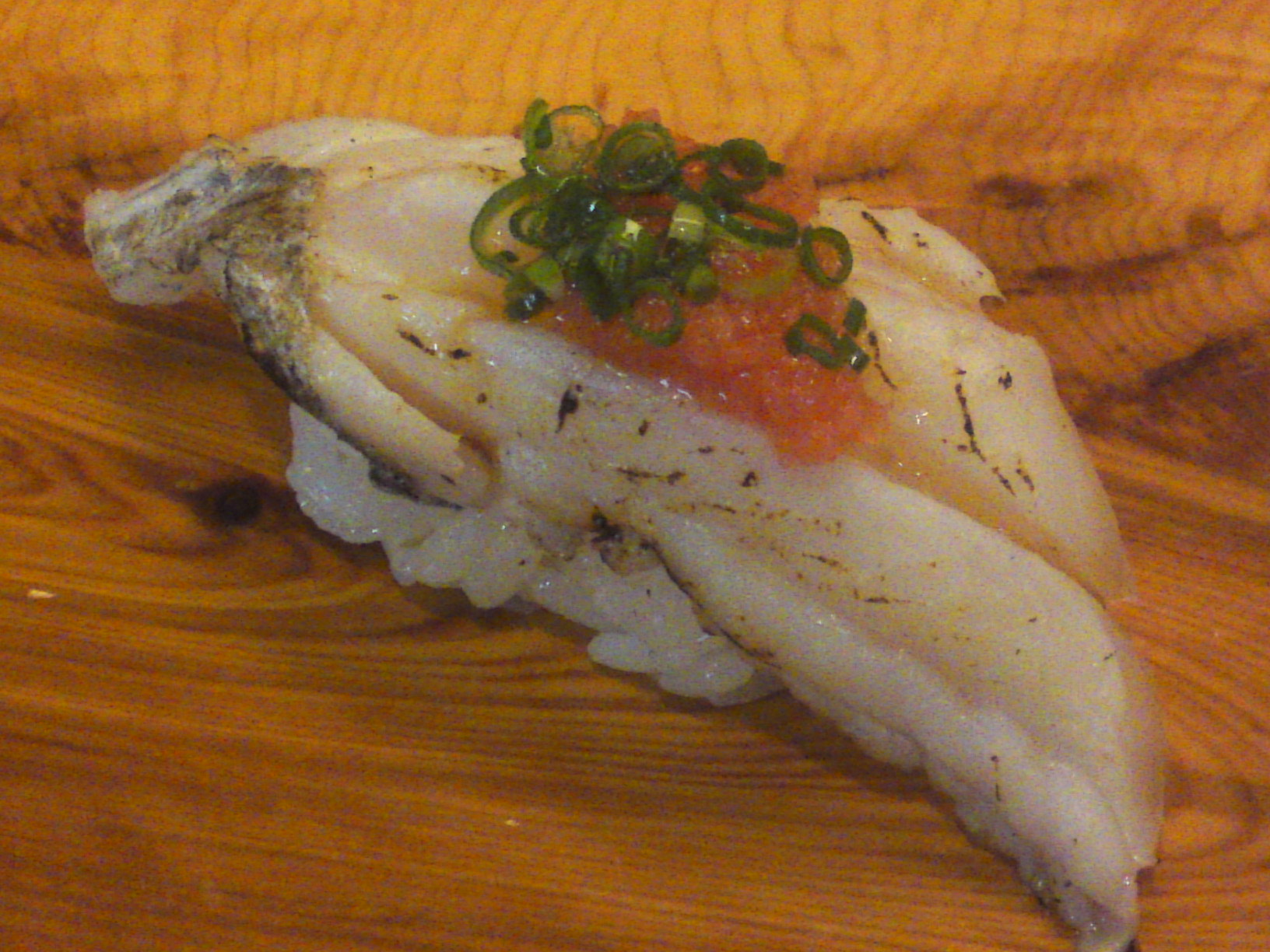 “Tachiuo/Scabbard or Cutlass Fish” nigiri in “Aburi/seared” style topped with “momiji oroshi/grated daikon seasoned with chili powder and chopped scallion
