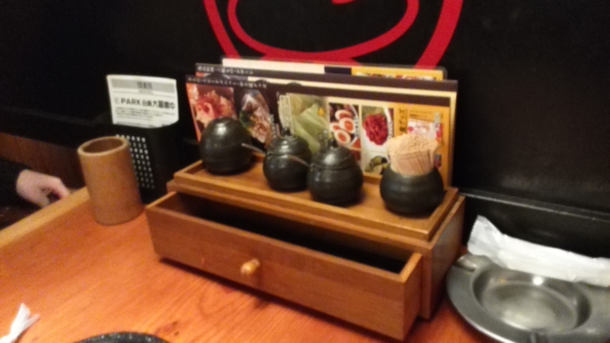 Little drawer at Torikizoku with chopsticks are various spices, a popular Japanese Izakaya restaurant