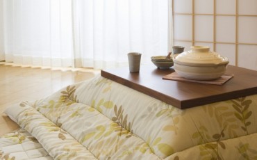 Kotatsu , a low and wooden Table Frame covered by a Futon