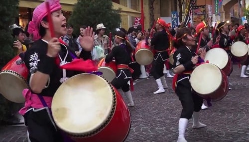 Ladies dancing and clapping in an Eisa festival