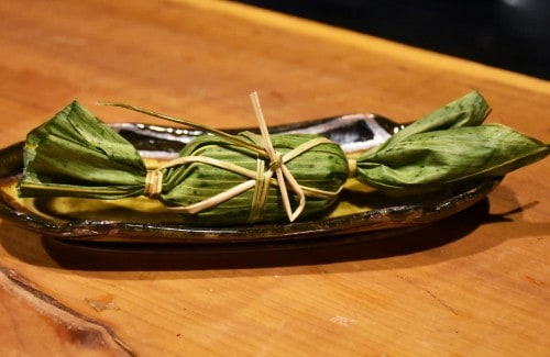 Mochi dessert wrapped in a bamboo leaf