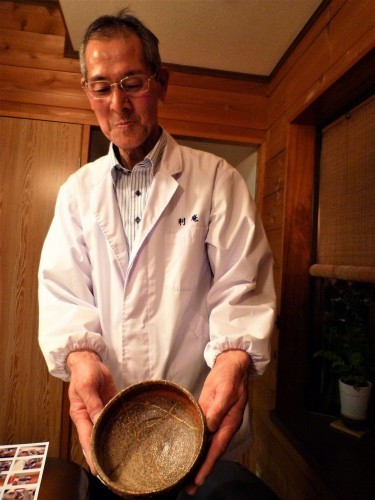 Mr. Saito, showing us one of his precious gold-injected ceramic utensils.