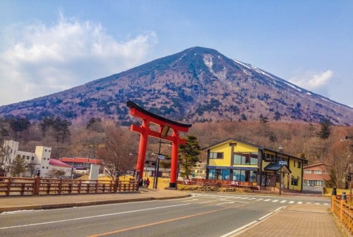 Torii gate in Nikko with views of the mountain