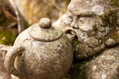 Over 460 statues rest beneath the cedar trees, each face unique.