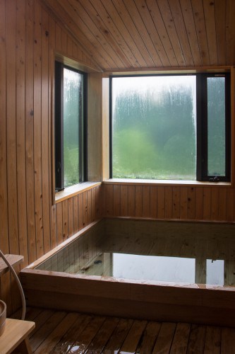 The relaxation and bathroom areas are located on the right side of the building at Tanekura Inn, Gifu prefecture. 