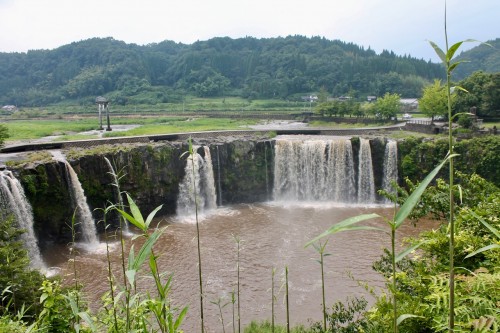 Harajiri Falls with Stone Torii behind in Oita prefecture, Kyushu, Japan.