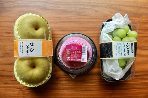 From Left to Right: Pears, a Peach and Grapes