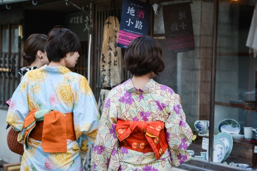 Yukata Girls Admiring the Ceramic Pottery