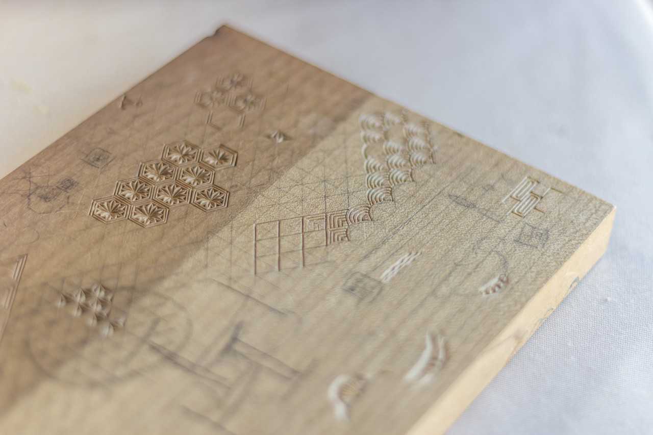 intricate details carved into japanese board for chopsticks making