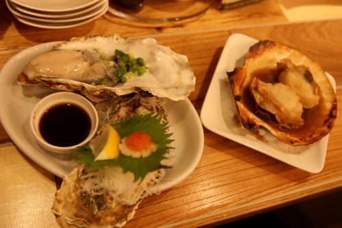 Oysters and shellfish at Japanese bar (Yokocho) in Tokyo