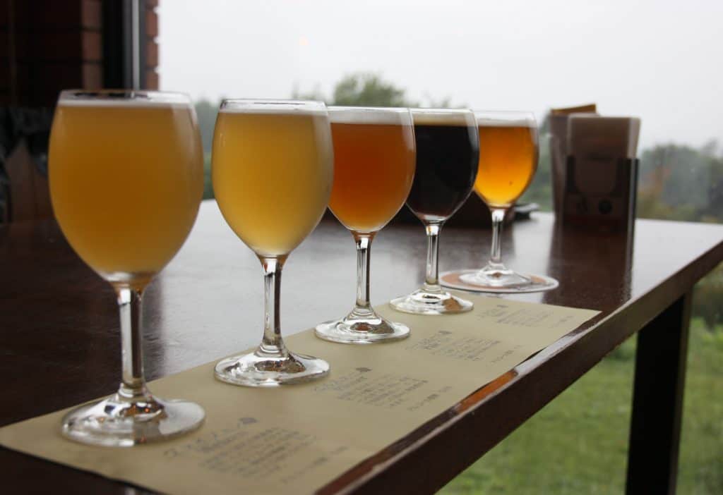 5 local craft beers lined up on a table at Bierhof Gambarius restaurant in Japan