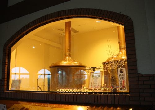 window looking into a brewery in Japan