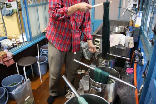 An artisan dyes thread at a workshop in Kagawa Prefecture, Japan.