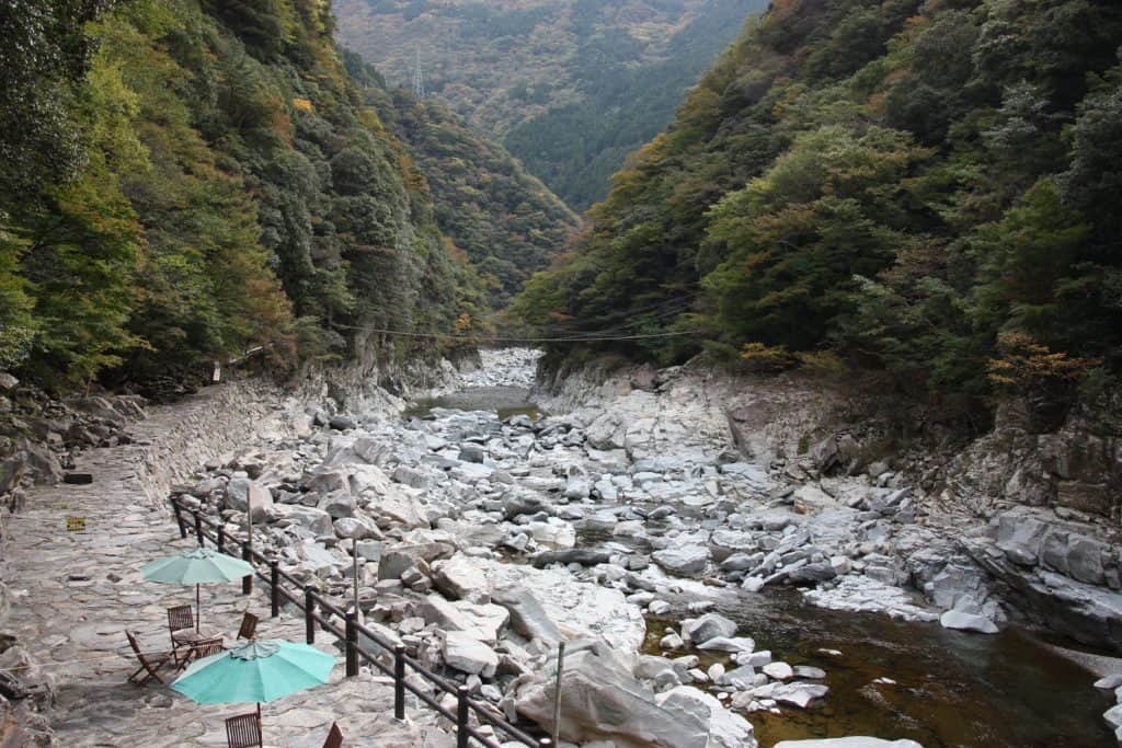 a valley filled with mountains and a river in Shikoku