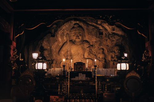 Buddhist image carved into rock, Nisseki Temple, Toyama.