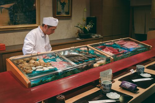 A chef prepares seasonal seafood from Toyama Bay into sushi