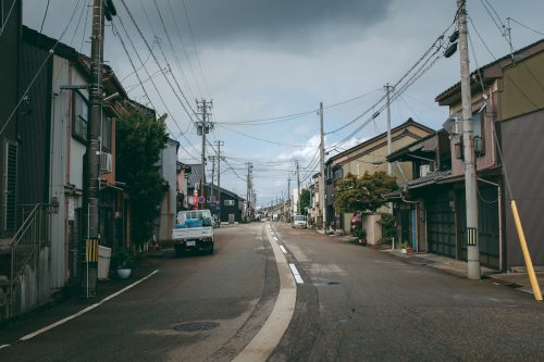 Narrow quiet streets of Takaoka city on Toyama Bay.