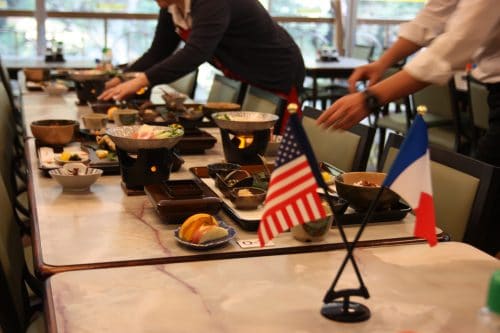 Attentive staff serves a delicious local meal at Obokekyo Mannaka Restaurant in Tokushima.