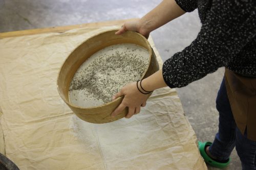 Sifting the soba flour for homemade soba noodles.