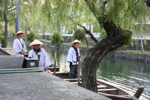 Boatsmen in Bikan historic distict of Kurashiki, Okayama.