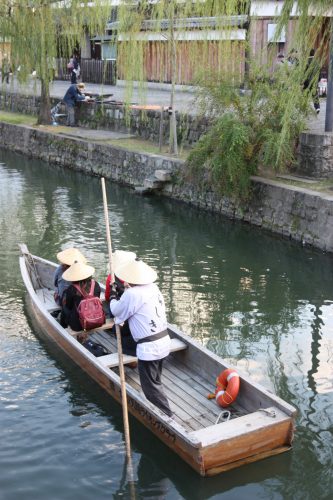 Taking a relaxing boat ride in the Bikan historic distict of Kurashiki, Okayama.