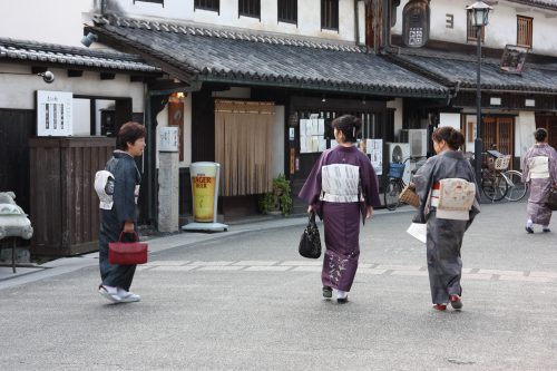 Strolling the streets in kimono in Bikan historic distict of Kurashiki, Okayama.
