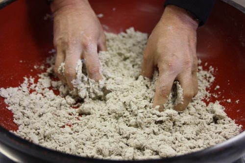 Kneading the dough to make homemade soba noodles in Eastern Shikoku.