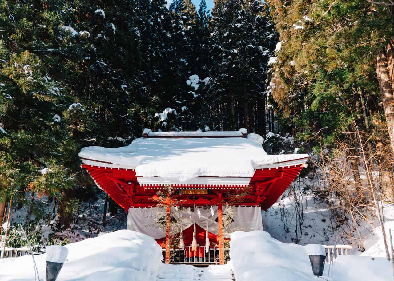 A shrine surrounded by snow