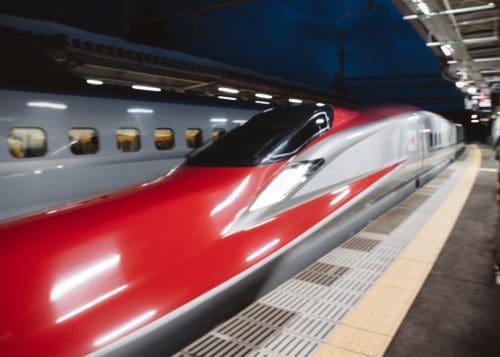 Bright red Komachi Shinkansen servicing Akita Prefecture.