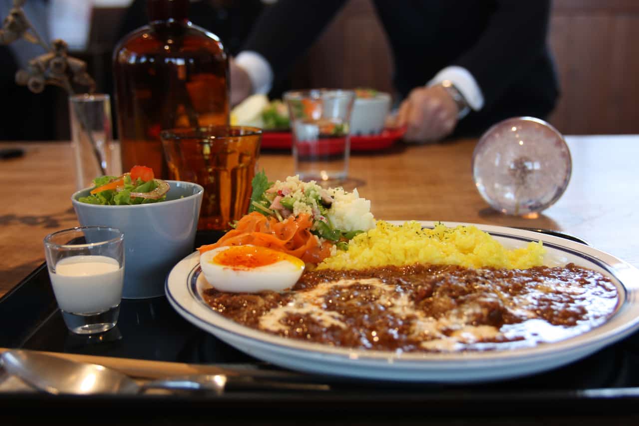 A plate of curry and some side dished served at Chiwata Station's restaurant.