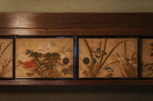 Details of cupboard doors painted with floral motifs at Tomaryanse