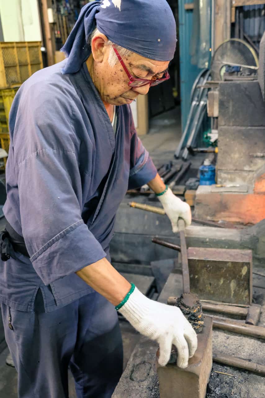 Mr. Matsunaga, a swordsmith in Arao, Kumamoto, in his studio