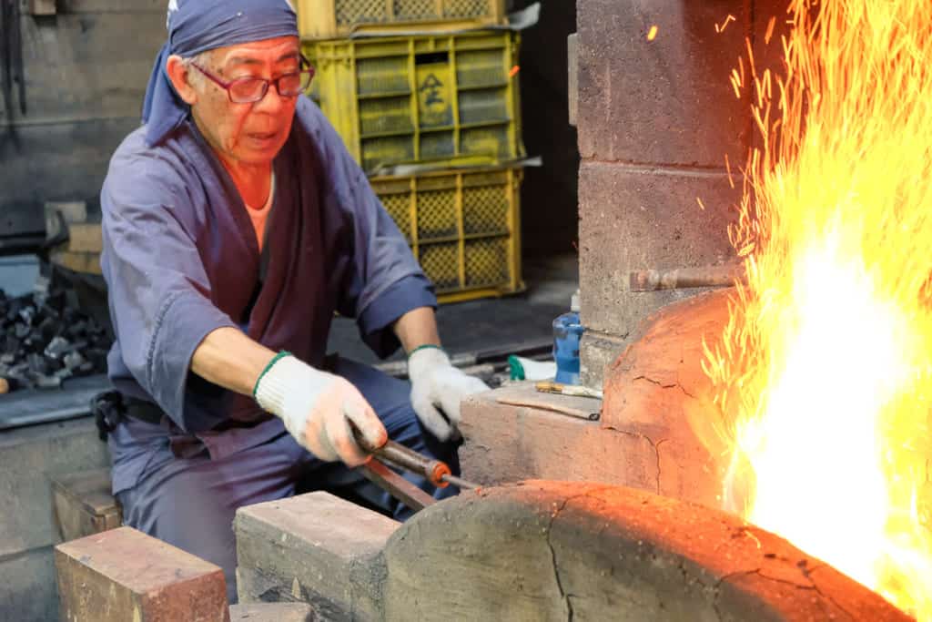 Mr. Matsunaga, a swordsmith in Arao, Kumamoto, working at his forge