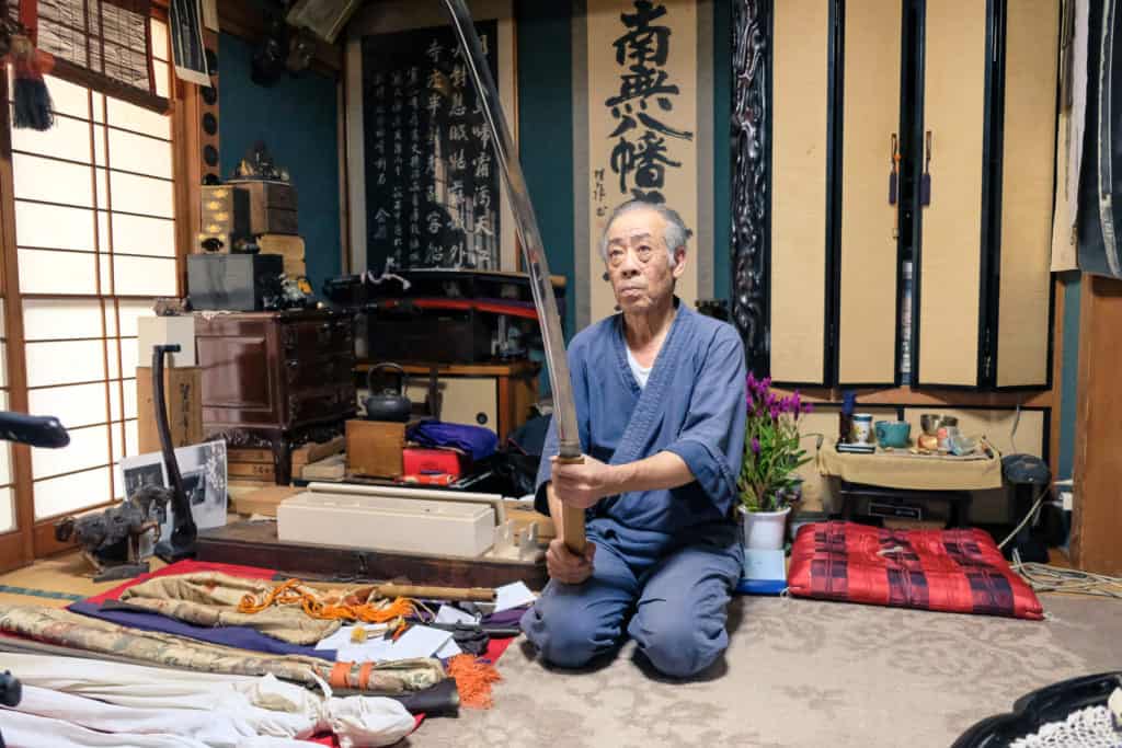 Mr. Matsunaga, holding a commissioned sword