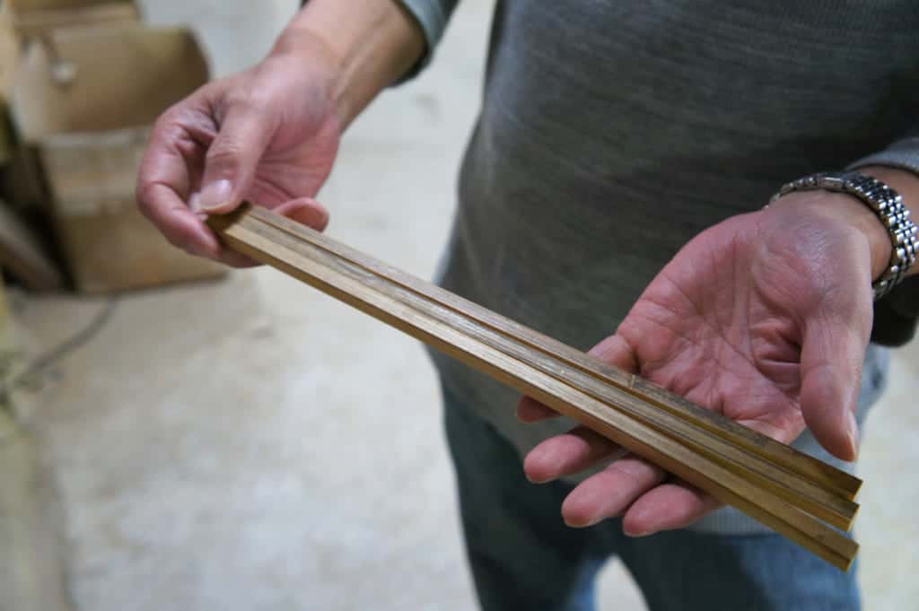 Mr Yamazaki, showing freshly cutted bamboo sticks
