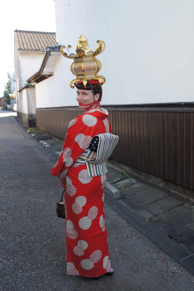 Clémentine wearing antic kimono and lantern in the streets of Yamaga