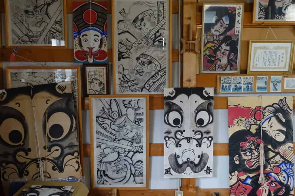 Managu kites hung on the wall of the Shunpu-Kan workshop in Yuzawa, Akita prefecture