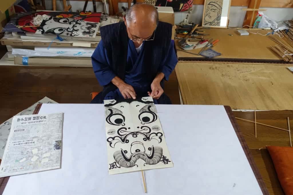 Mr. Ono in the process of making a traditional managu kite