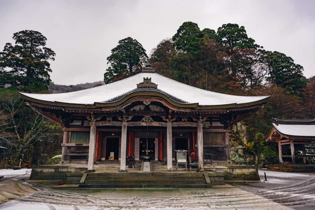 Japanese shrine with snowy roof