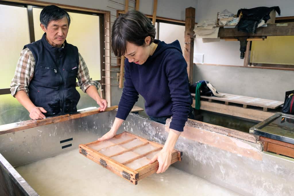 making japanese washi paper the traditional way in Kyoto, Japan