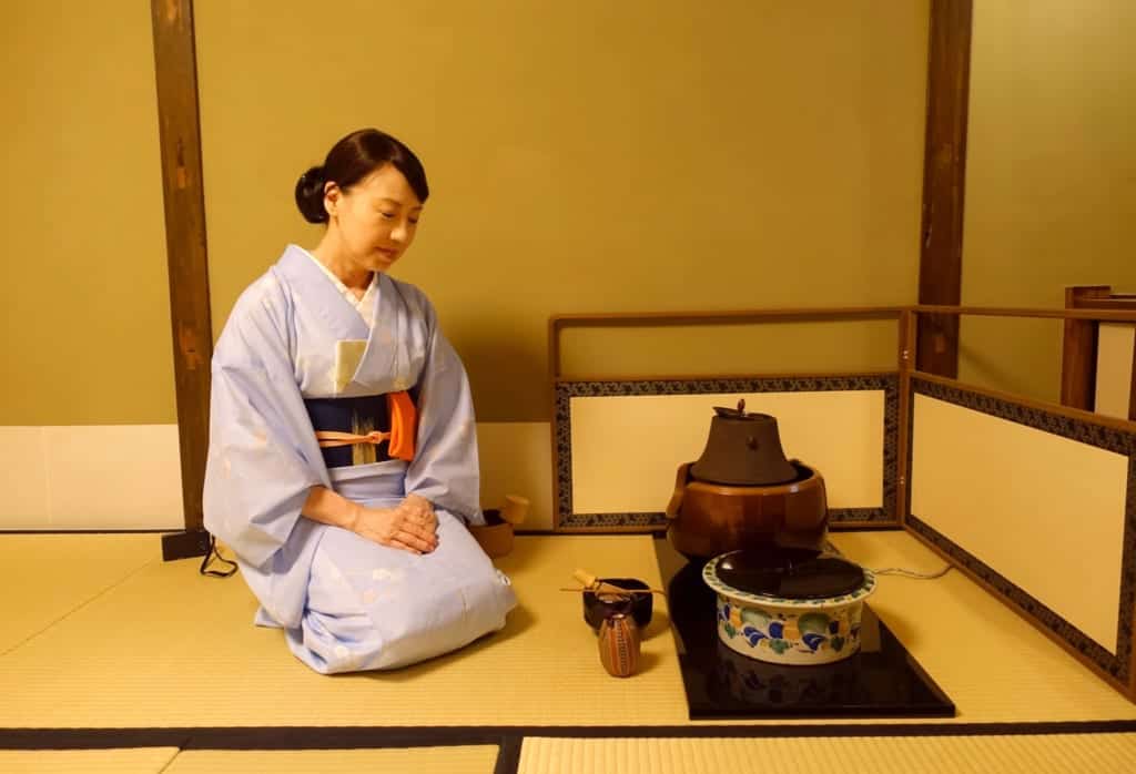 Tea ceremony hosted by a woman in traditional Japanese kimono
