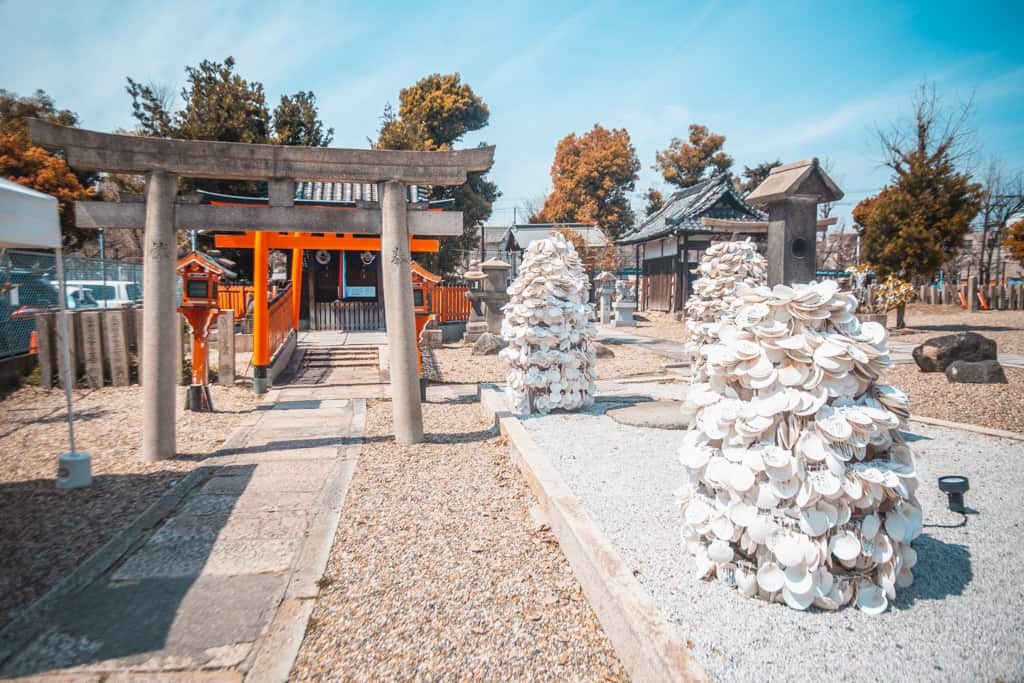 Scallop shells' pillars. Himejima shrine, Osaka