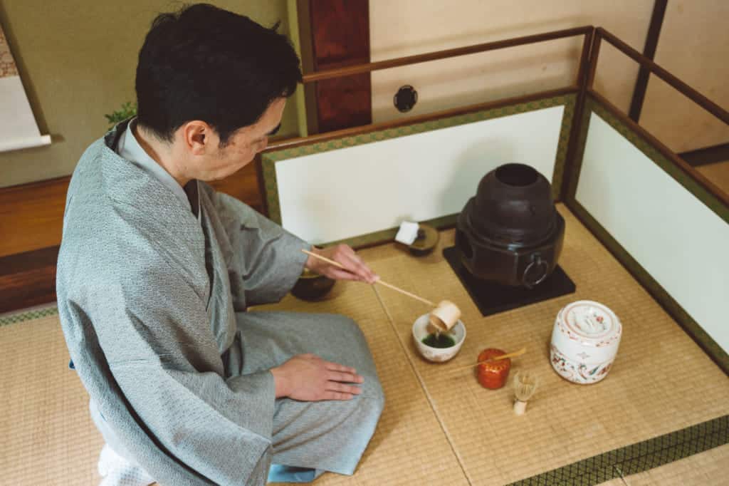 man practicing tea ceremony