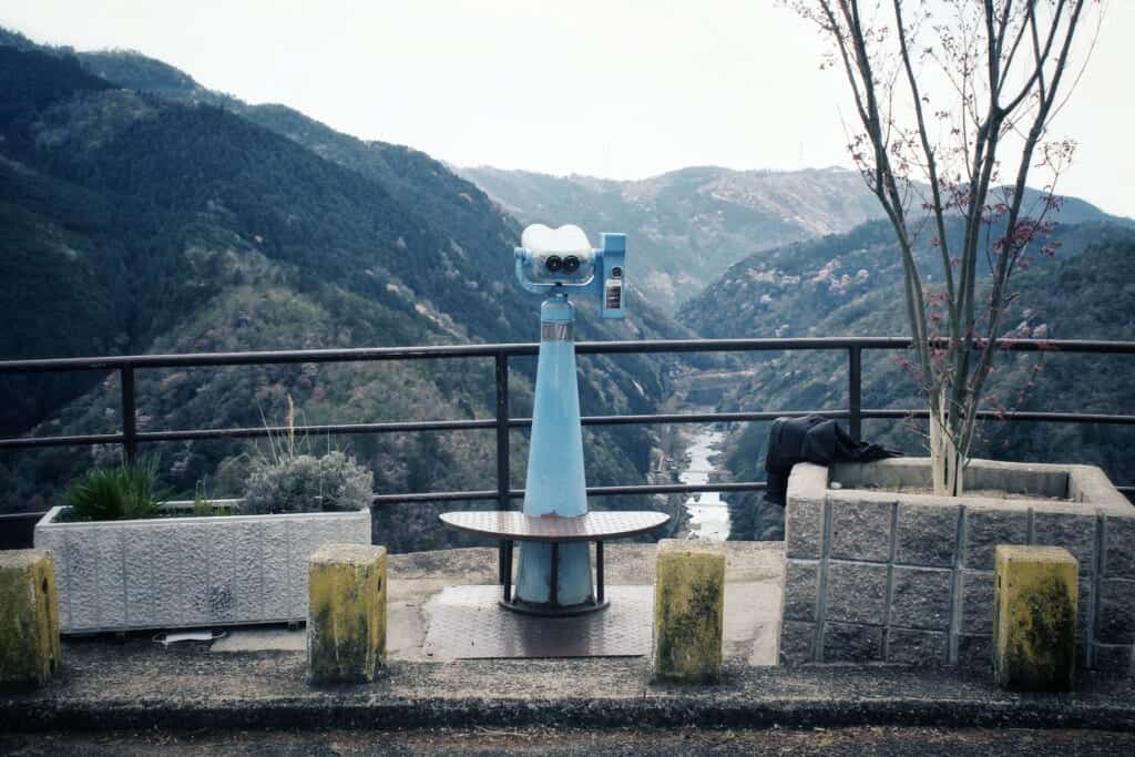 One of the telescopes that can be found at Hozukyo Lookout Point