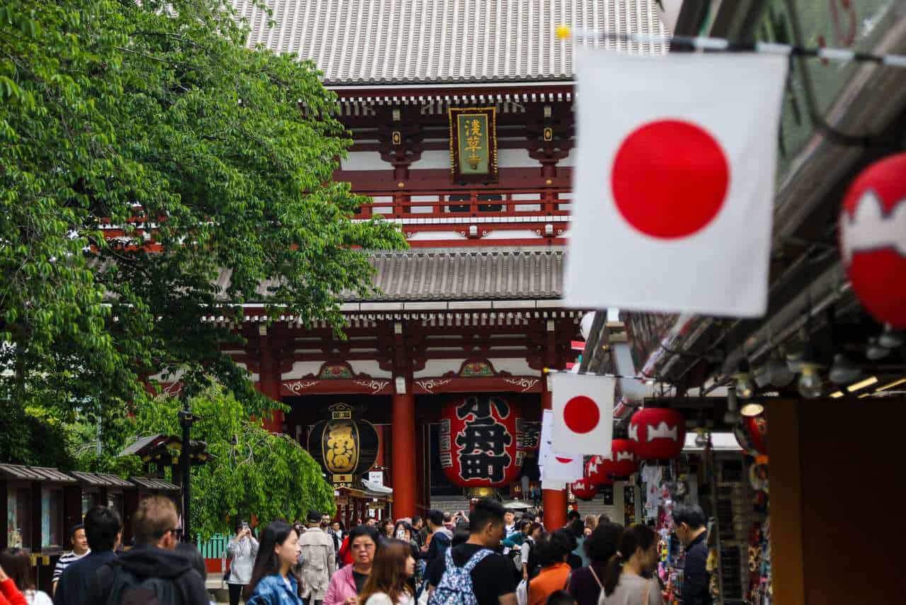 Japanese flags in front of a srhine