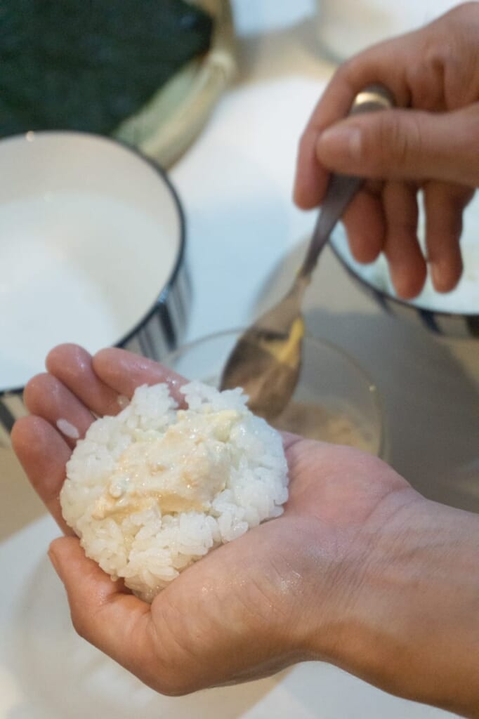 Add the filling at the center of the onigiri